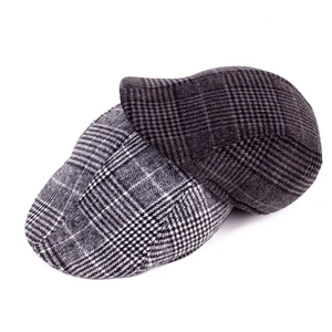 Detail of wool blend plaid flat cap showing traditional checkered fabric texture