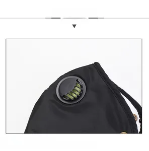 Detail of a black breathable mask showing the knit edge and circular ventilation valve
