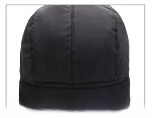 Detailed close-up of the reinforced stitching and durable fabric on the winter cap crown