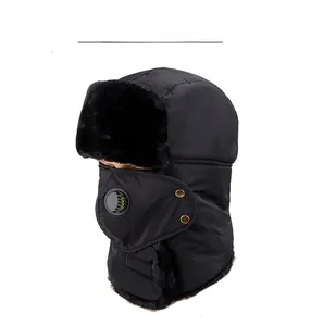 Detail of black winter trapper hat featuring a built-in mask and breathing valve component