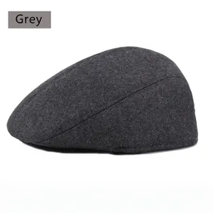 Close-up of grey wool blend newsboy cap showing detailed thick fabric texture