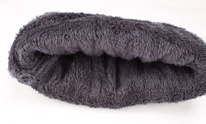 Detailed view of the thick dark grey plush lining of a thermal winter neck gaiter