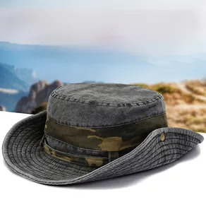 Detail of gray outdoor bucket hat featuring camouflage band and metal rivet decoration