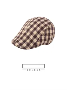 Detail of coffee plaid pattern on a retro men's flat cap made of thick textured fabric