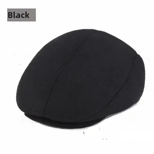 Detail view of the stitching and reinforced visor on this thick black winter beret cap