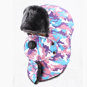 Detail view of pink camouflage winter bomber hat with gray faux fur and a breathing valve mask