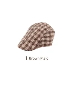 Detail of coffee plaid woolen fabric on a flat cap with thick vintage texture