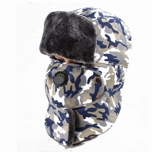 Close-up of camouflage trapper hat with thick plush lining and integrated face mask