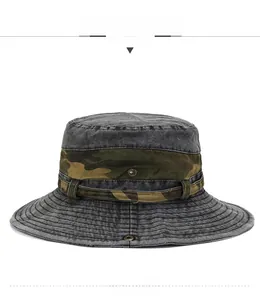 Detail of grey washed outdoor boonie hat with camouflage webbing and wide stitched brim