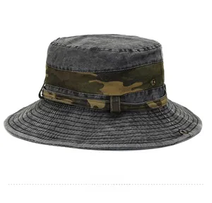 Detail of outdoor sun hat featuring side metal eyelets and camouflage decorative ribbon