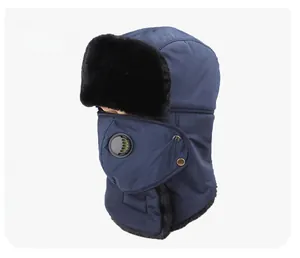 Detail of navy windproof trapper hat with black faux fur trim and integrated breathing valve