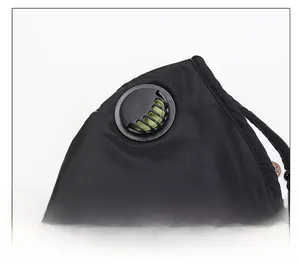 Close-up of black protective face mask featuring circular breathing valve and seam detail