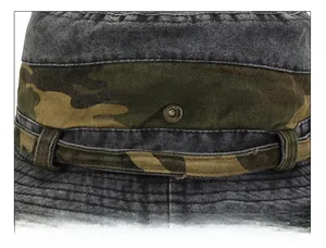 Close-up of washed denim outdoor hat with camouflage band and bronze metal snaps detail