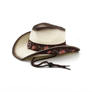 Detail of western straw hat featuring pink rose embroidery and brown windproof rope
