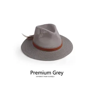 Detail of breathable gray mesh sun hat featuring a stylish brown leather band and tassel