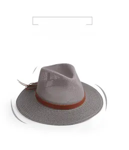 Detail of grey straw sun hat featuring a 5cm brim and brown leather decorative band