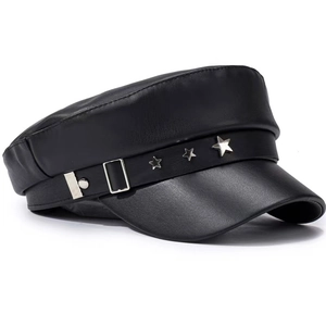 Detail of matte black leather newsboy cap featuring silver star rivets and metal buckle