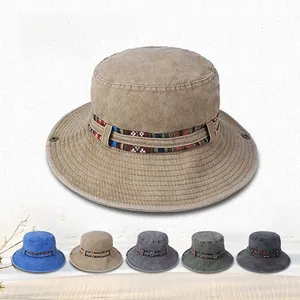 Detail of outdoor bucket hat with tribal woven band and breathable metal eyelets