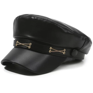 Detail of black faux leather baker boy hat featuring double gold chain and side buttons