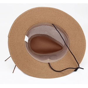 Detail view of straw sun hat interior showing breathable mesh lining and adjustable chin cord