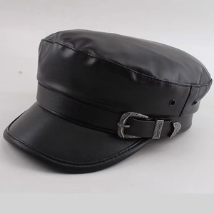 Detail of black PU leather baker boy hat with silver metal buckle and side air vents