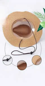 Detail of brown straw hat with 58cm size, chin strap, mesh lining and sweatband