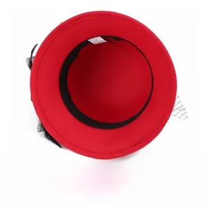 Macro shot of red wool felt hat interior with size 57 label and black sweatband detail