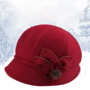 Detailed view of the thick black plush lining inside the warm red wool bucket hat
