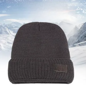 Detailed knit texture of dark gray winter beanie with Sport Fashion logo patch