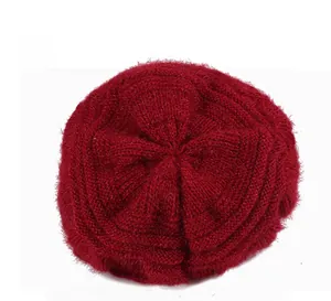 Macro shot of the plush knit texture and circular weave on the back of this wine red cap
