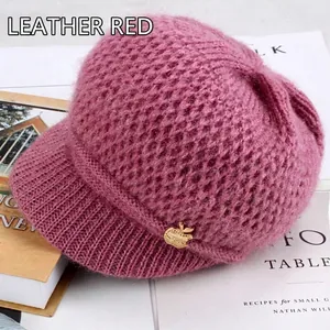 Women's warm mauve knitted beanie hat with visor and small gold apple accent
