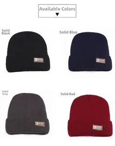 Detail view of four winter beanies in black navy grey and red with Sport Fashion label