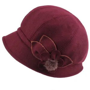Winter wool cloche hat in wine red with fabric flower and plush ball decoration