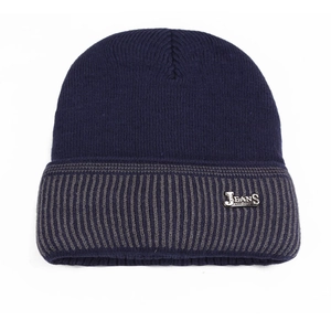 Detail of dark blue ribbed knit beanie with silver JEANS metal tag and gray stripe trim