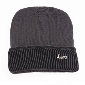 Detail of a two-tone winter beanie showing the dark grey knit and JEANS logo plate