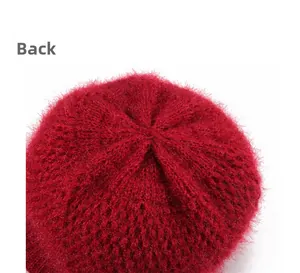 Detail view of the red knit hat crown stitching and high-quality textured wool fabric