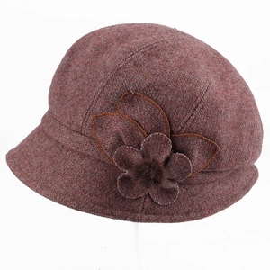 Winter wool cloche hat in burgundy featuring thick fabric and side flower with fur pompom