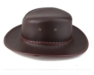 Detail view of brown leather cowboy hat with braided strap and metal ventilation eyelets