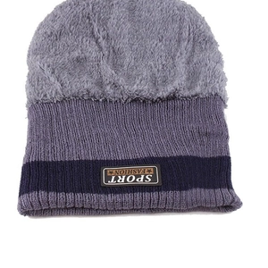 Winter knit beanie featuring gray faux shearling and fleece lining for warmth