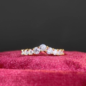 Elegant 18K gold plated S925 sterling silver V-shaped moissanite ring on red velvet