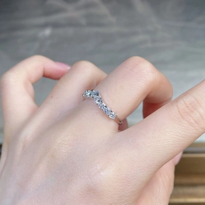 Detail of V-shaped S925 sterling silver ring with seven sparkling round moissanite stones