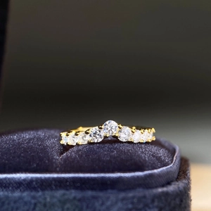 Macro detail of V-shaped S925 sterling silver ring with sparkling moissanite stones