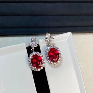 Elegant S925 sterling silver ruby stud earrings with halo diamonds and a fanned hook design