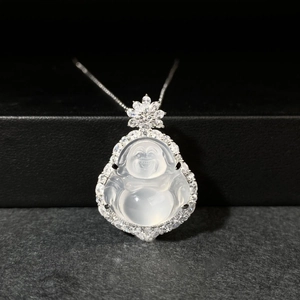 Macro shot of silver Buddha pendant with ice chalcedony and micro-pave crystals