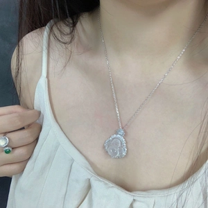 Close-up of S925 silver Buddha pendant with ice chalcedony and matching gemstone rings
