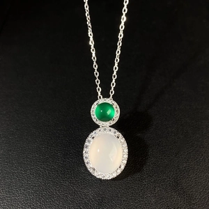 Detailed view of S925 silver necklace with green chalcedony and white jade pendants