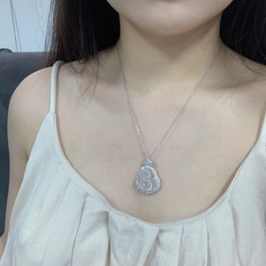 Close-up of S925 silver Buddha pendant with green chalcedony and white crystal halo