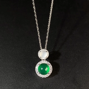 Macro view of S925 silver necklace with green chalcedony pendant and crystal halo