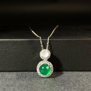 Close-up of S925 silver necklace with green chalcedony and white agate pendants
