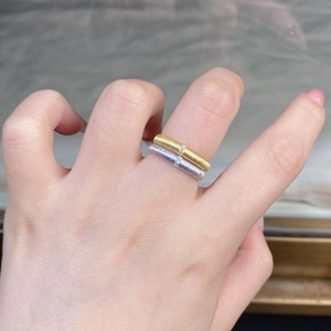 Macro detail of minimalist 925 sterling silver brushed rings with pave set zircon stones
